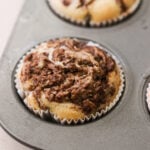 a photo of a nutella muffin baking in a muffin tin