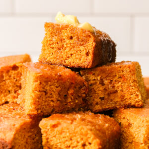 squares of sweet potato cornbread stacked on top of each other