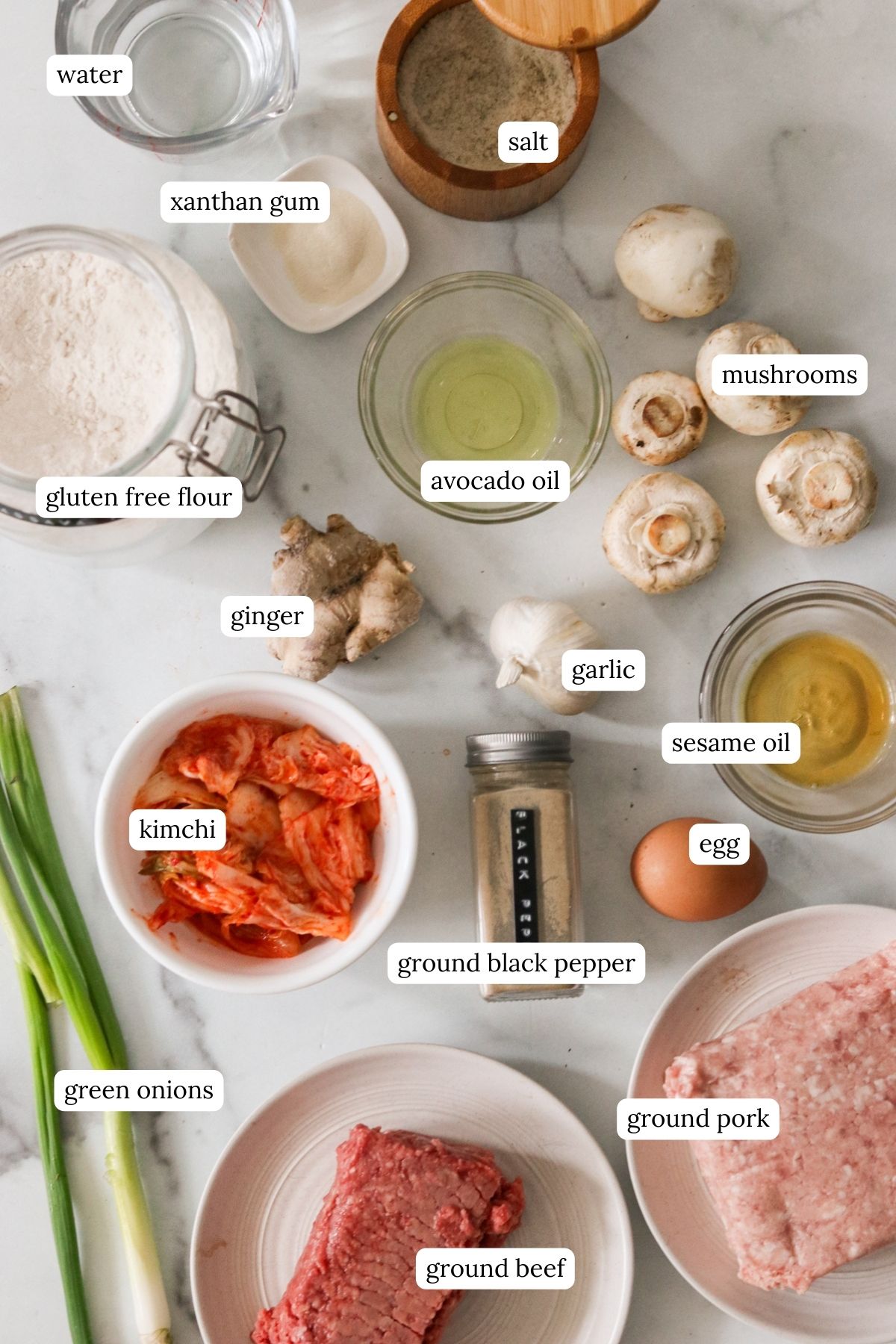 Ingredients in small bowls for mandu and gluten free dumpling wrappers