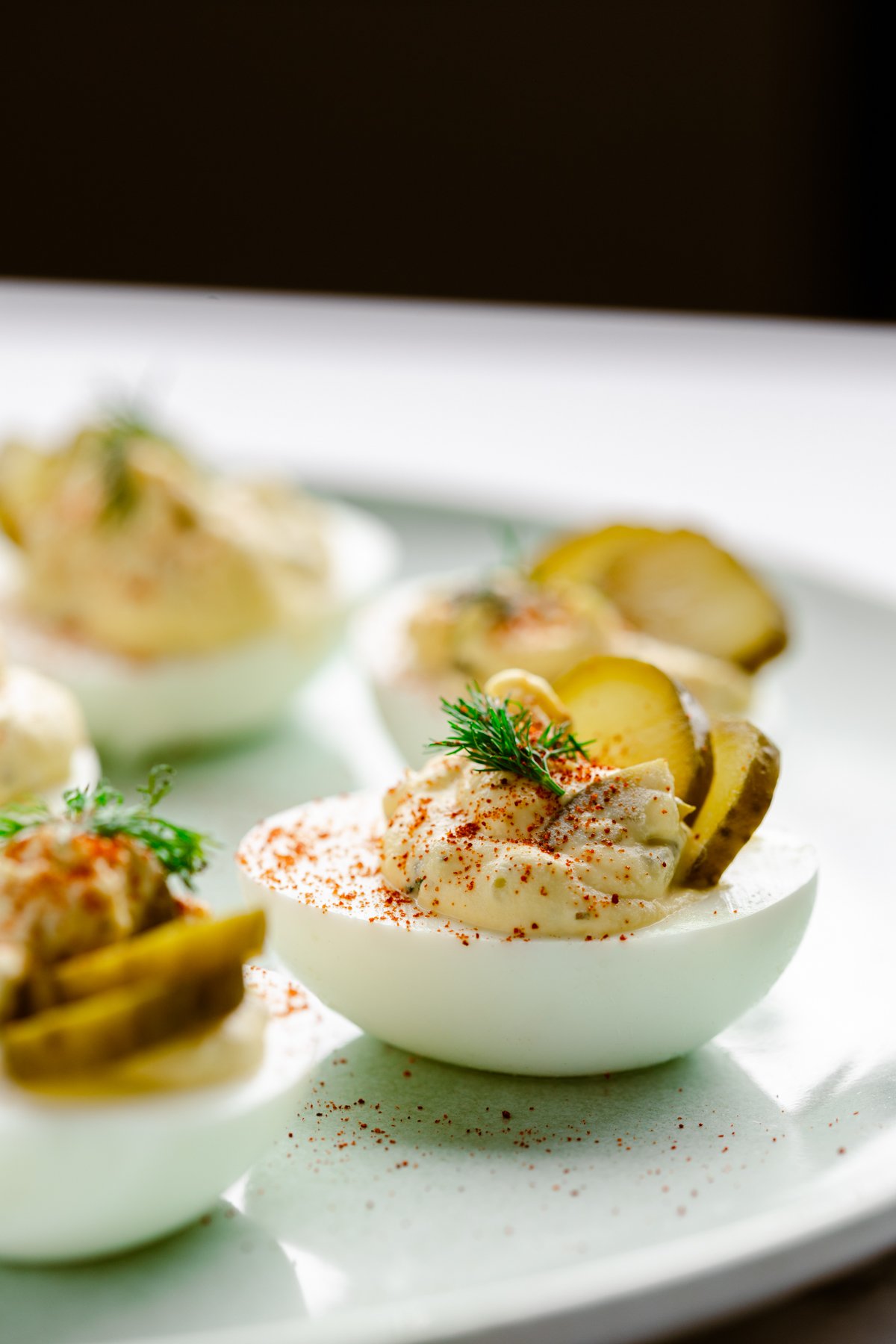 a close up photo of a dill pickle deviled egg