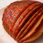 a close up view of a ham sliced after cooking