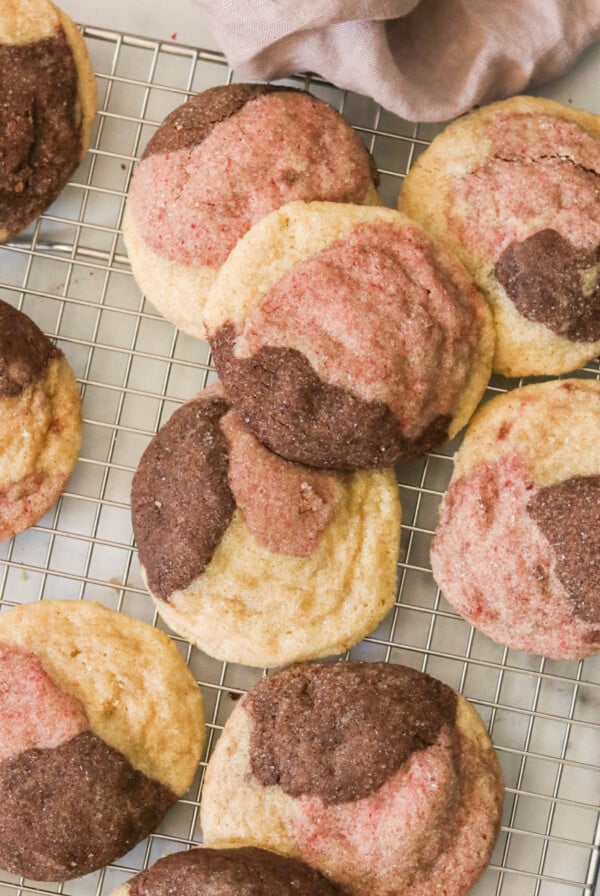an overhead shot of neapolitan cookies on a wire rack