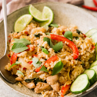 thai basil chicken fried rice in a bowl with a spoon