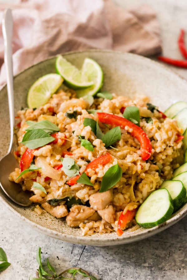 thai basil chicken fried rice in a bowl with a spoon