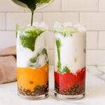 two glasses of matcha bubble tea with boba straws