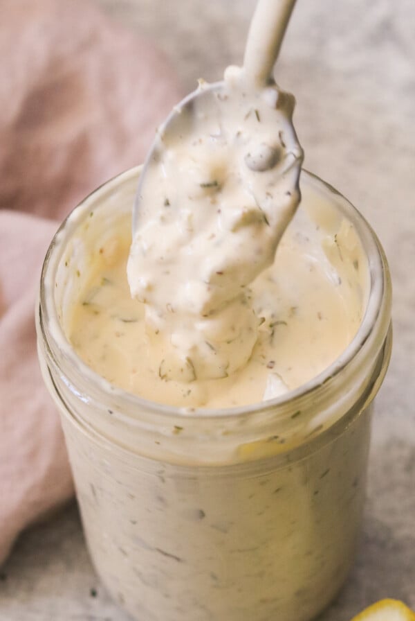 a homemade tartar sauce recipe in a mason jar with a spoon