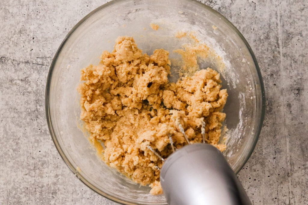 Mixing in dry ingredients to make cinnamon roll cookie dough