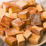 pumpkin marshmallow squares on a plate.