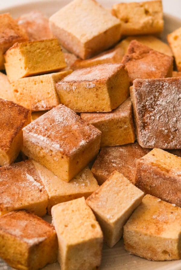 pumpkin marshmallow squares on a plate.