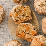 a close up of a persimmon muffin cut in half