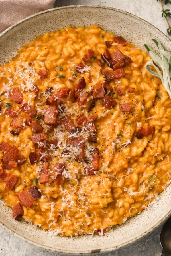 creamy pumpkin risotto topped with bacon and parmesan