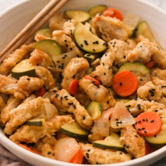 Tangsuyuk in a bowl with veggies.