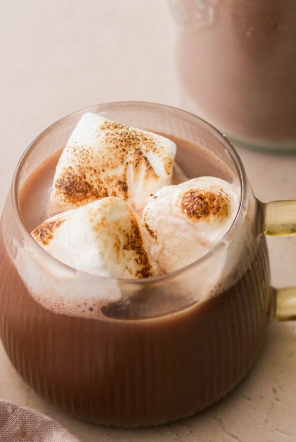 a mug of dairy free hot chocolate topped with marshmallows