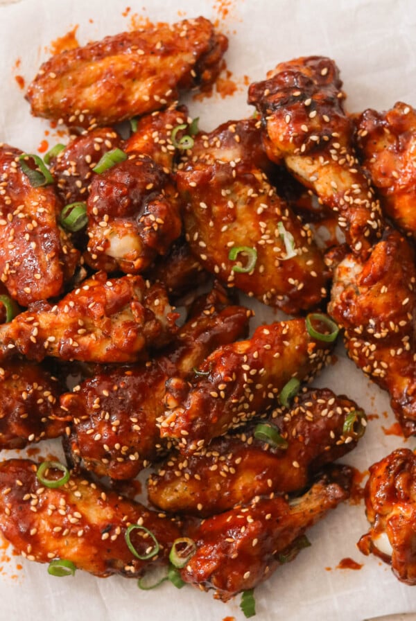 gochujang chicken wings on a white sheet of parchment paper
