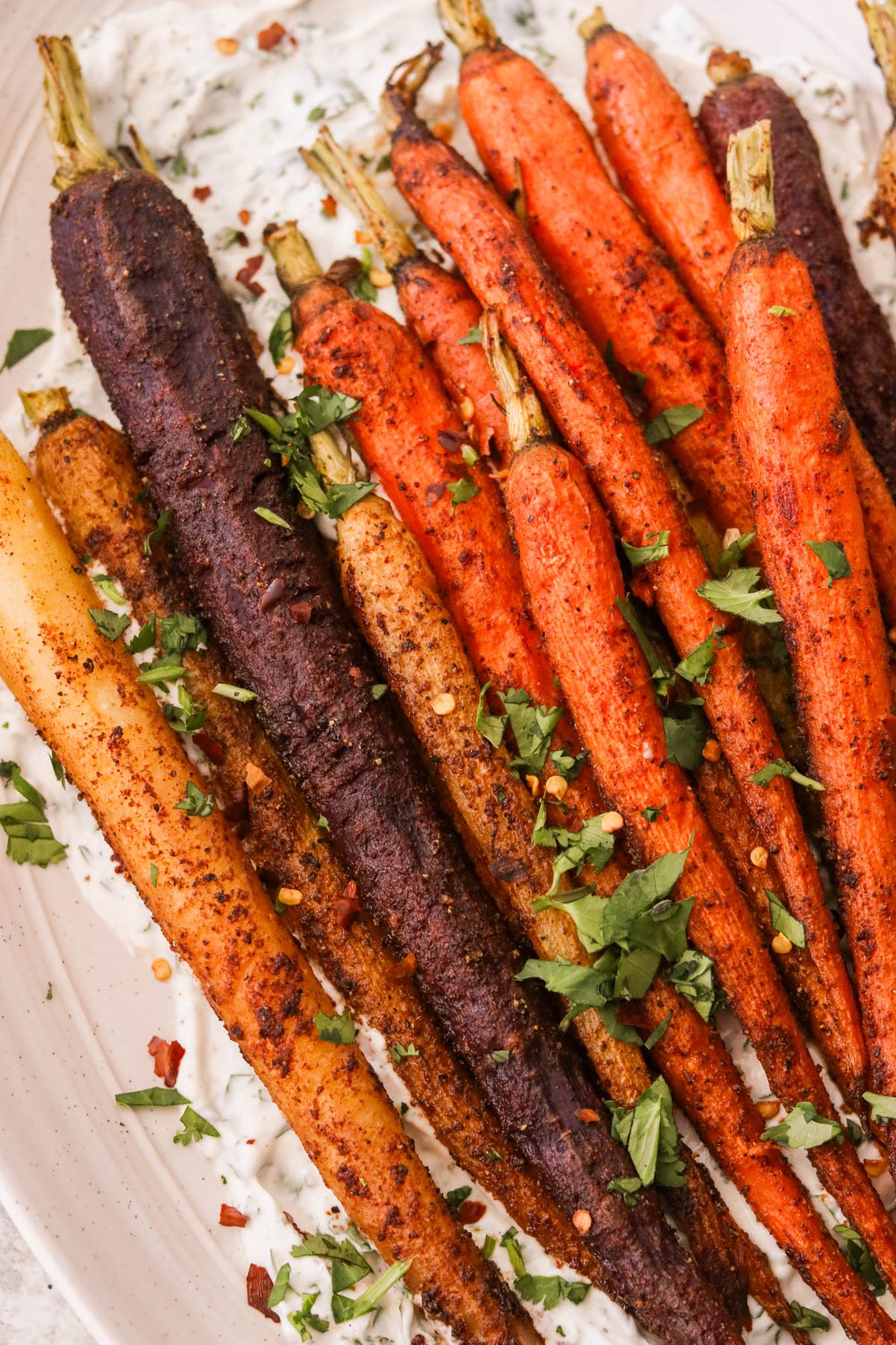 a close up of moroccan carrots sprinkled with cilantro 