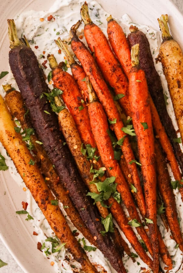 colorful moroccan spiced carrots on a white serving platter