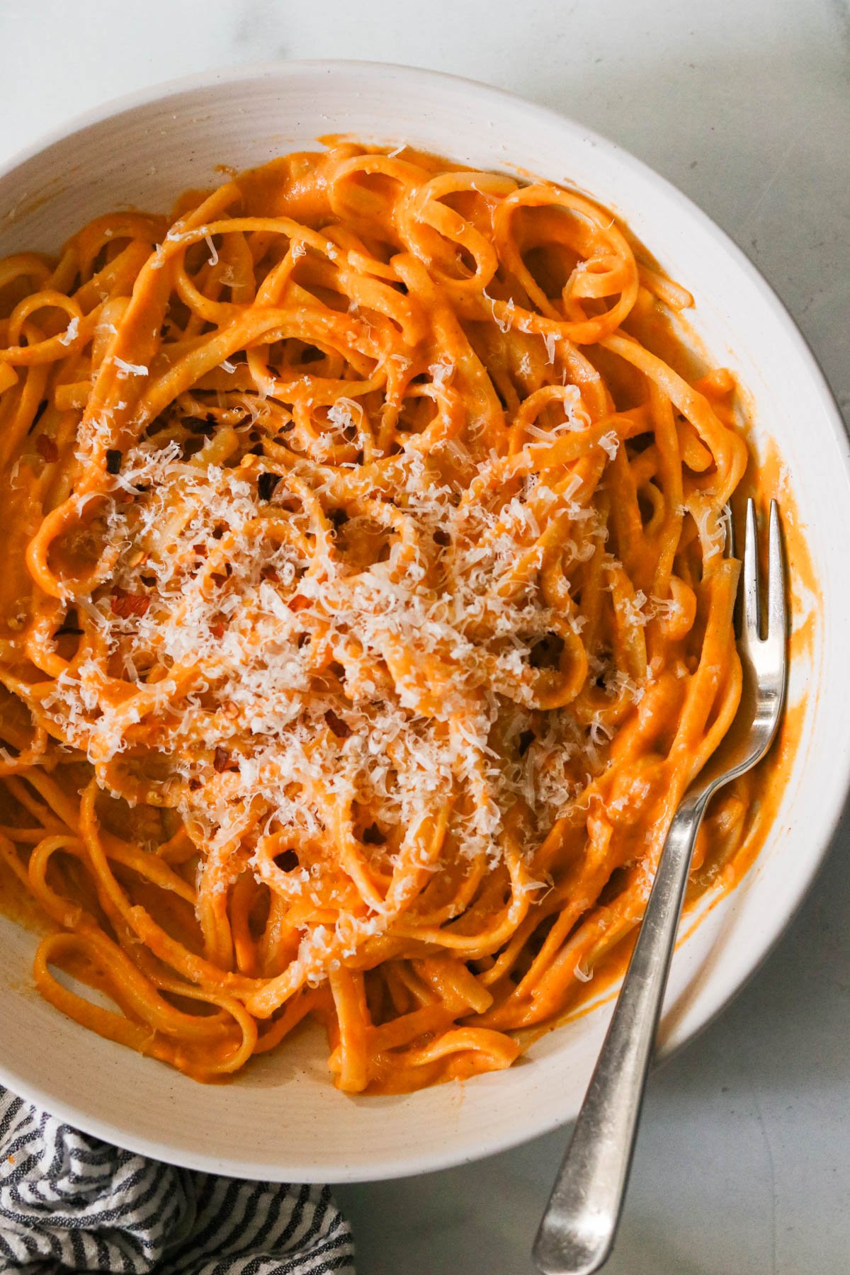 hidden veggie pasta sauce mixed with fettuccini noodles and topped with parmesan cheese. 