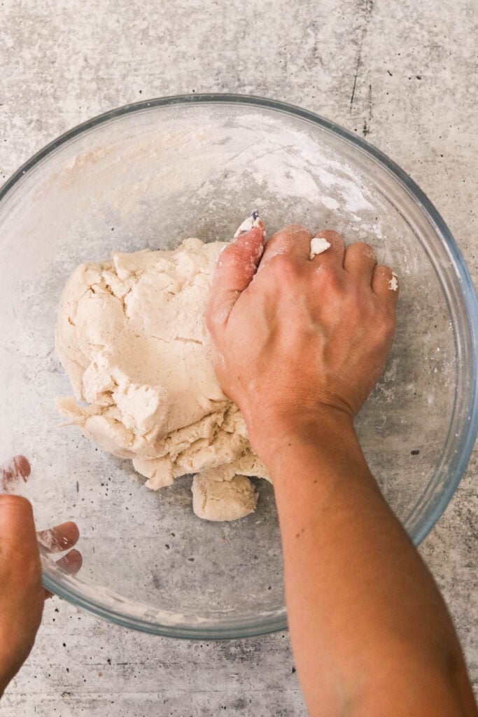 kneading dough in a bowl 