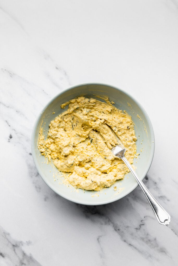 a bowl of yolks mixed with the spices