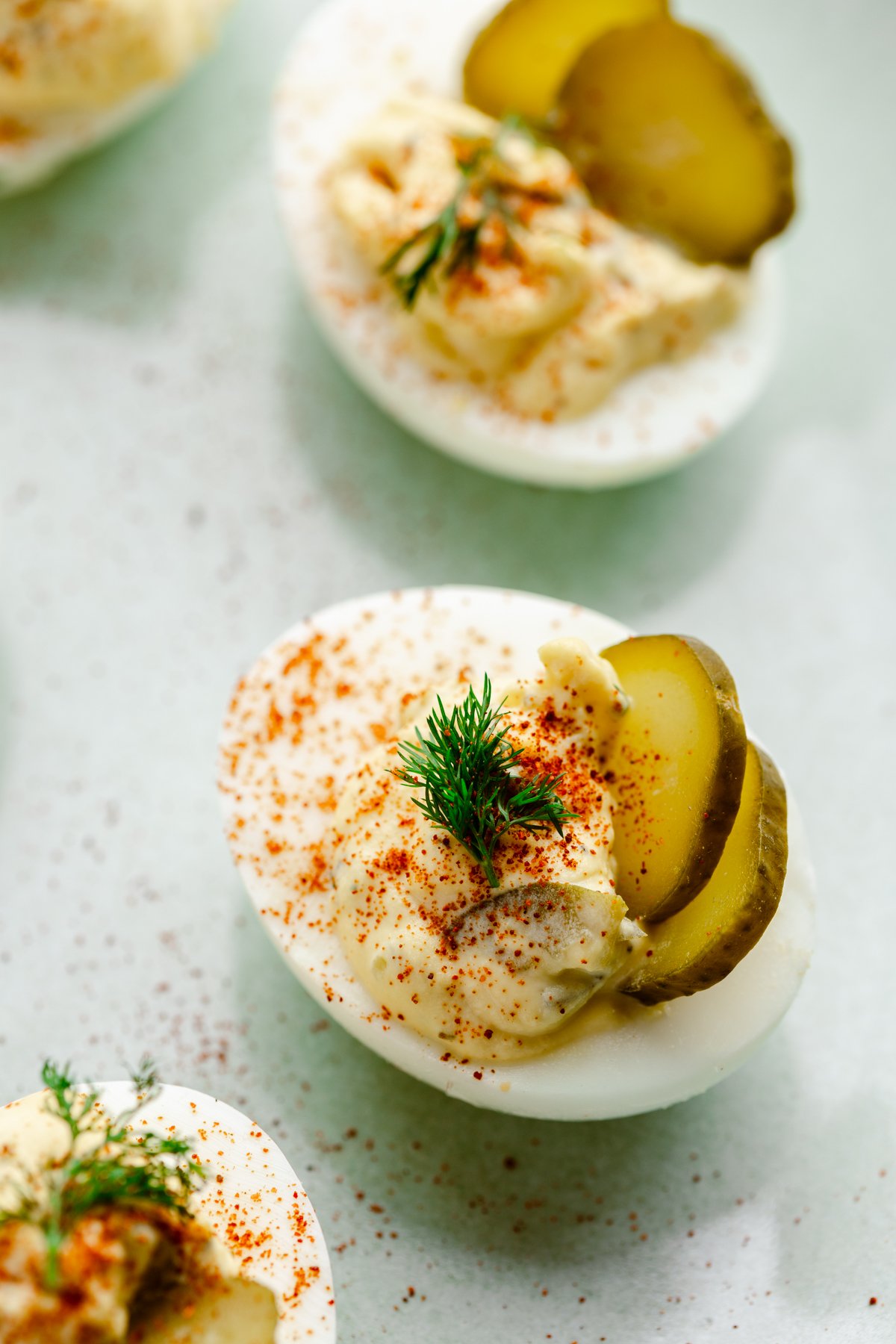dill pickle deviled eggs on a counter
