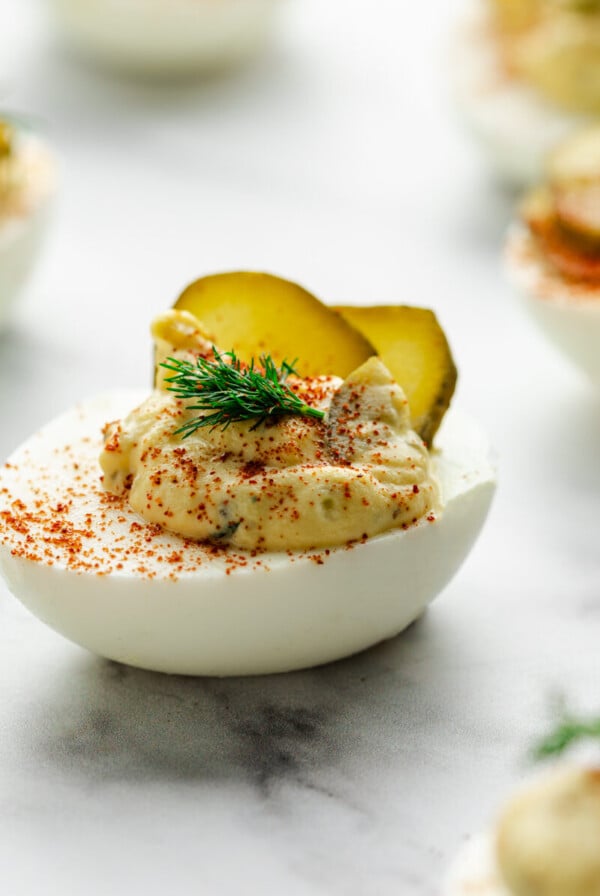 a close up photo of a dill pickle deviled egg