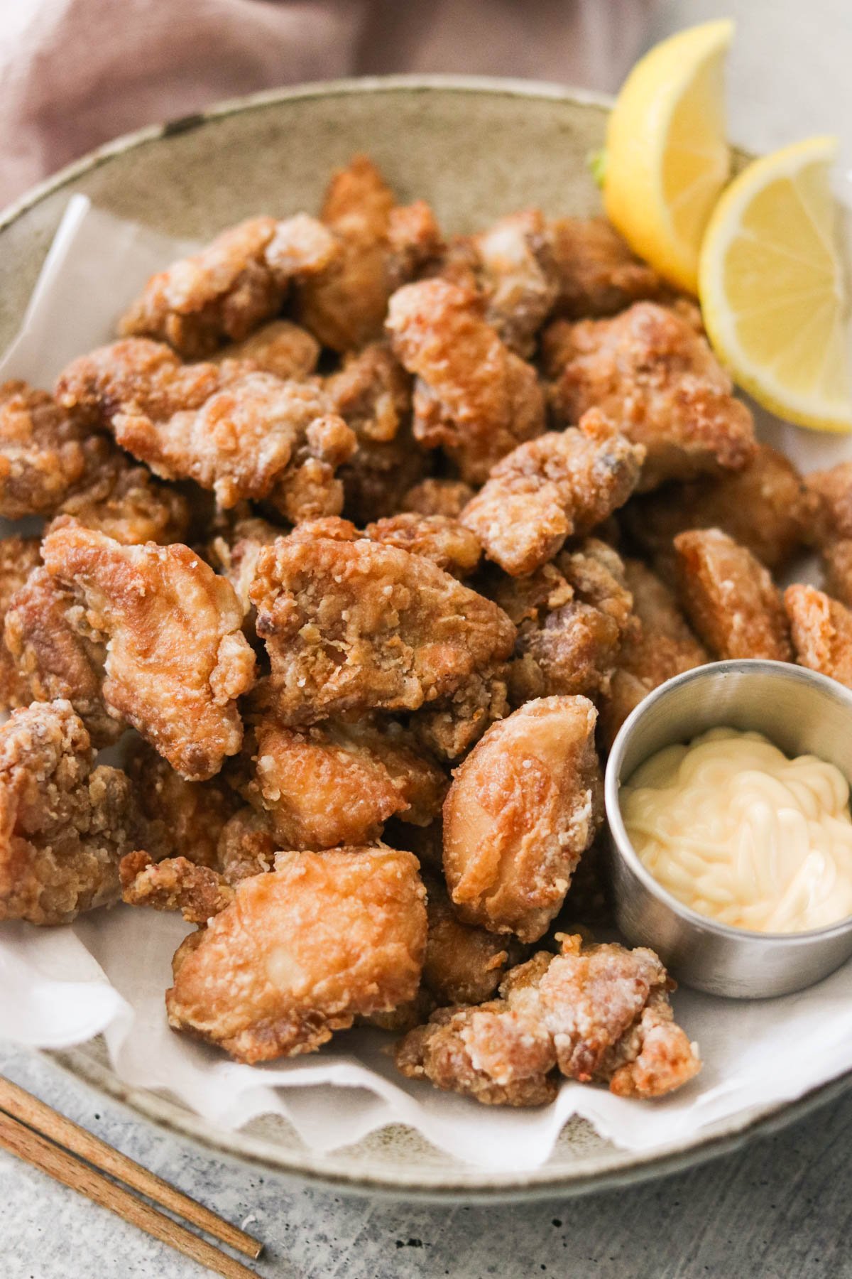 air fryer karaage next to lemon slices and japanese mayo