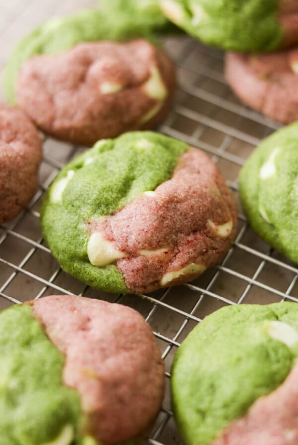 baked strawberry matcha cookies cooling on a wire rack