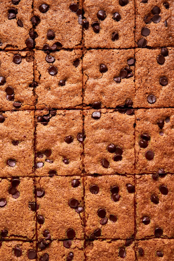 Slicing gluten-free blondies into squares after baking