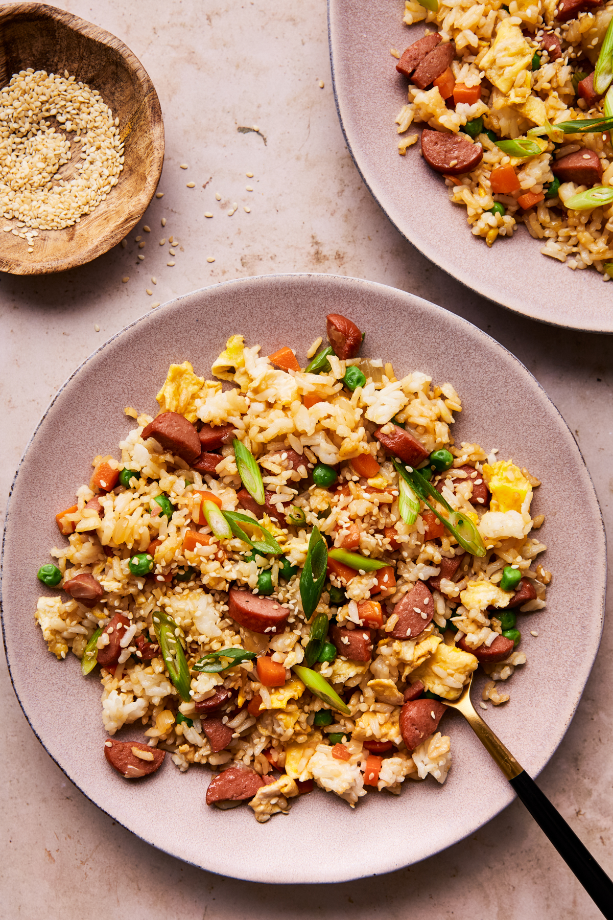 hot dog fried rice on a plate with a fork