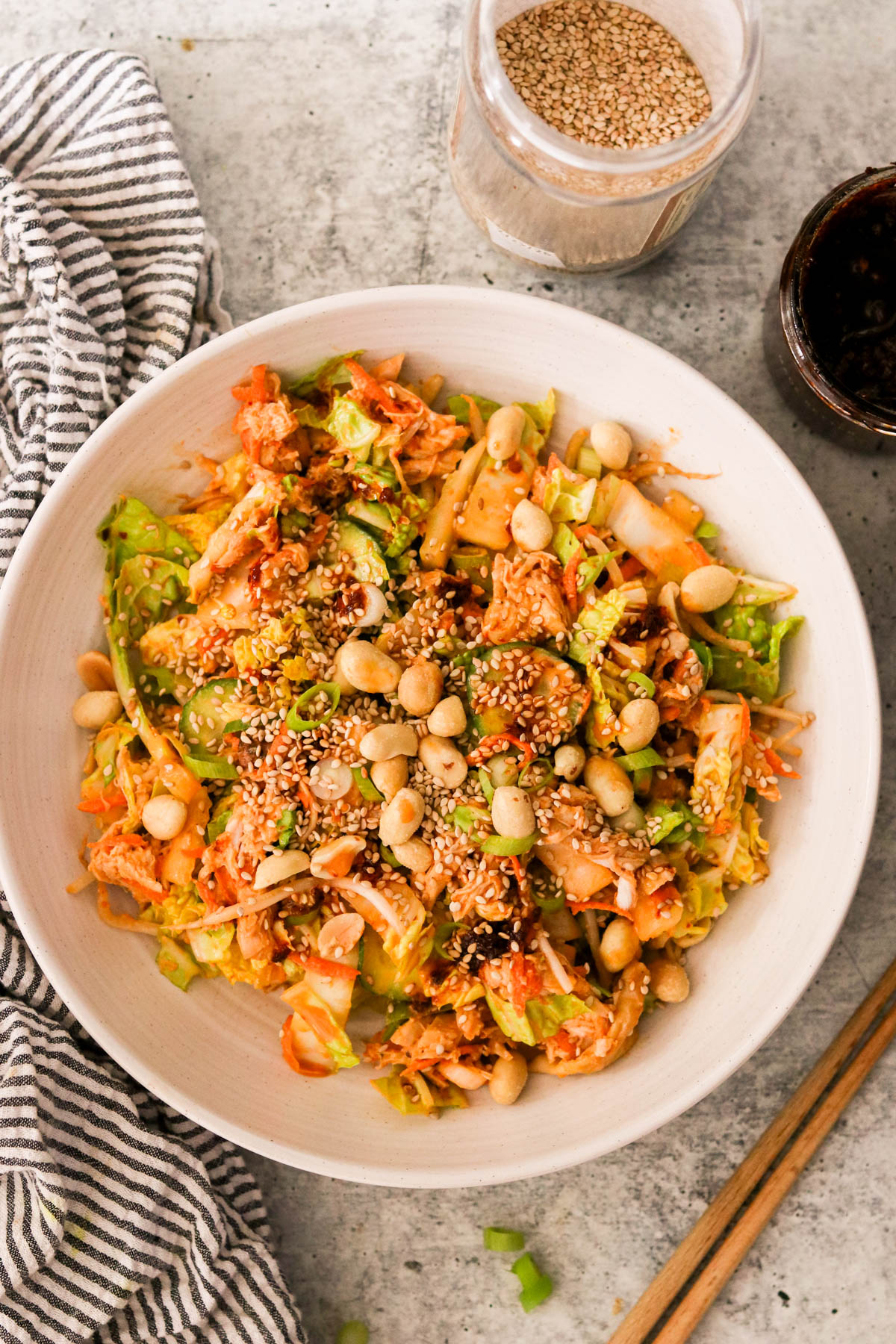 Close-up of plated bang bang chicken salad with toppings