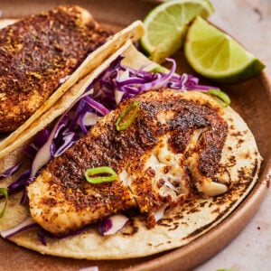 a piece of air fry tilapia atop a tortilla