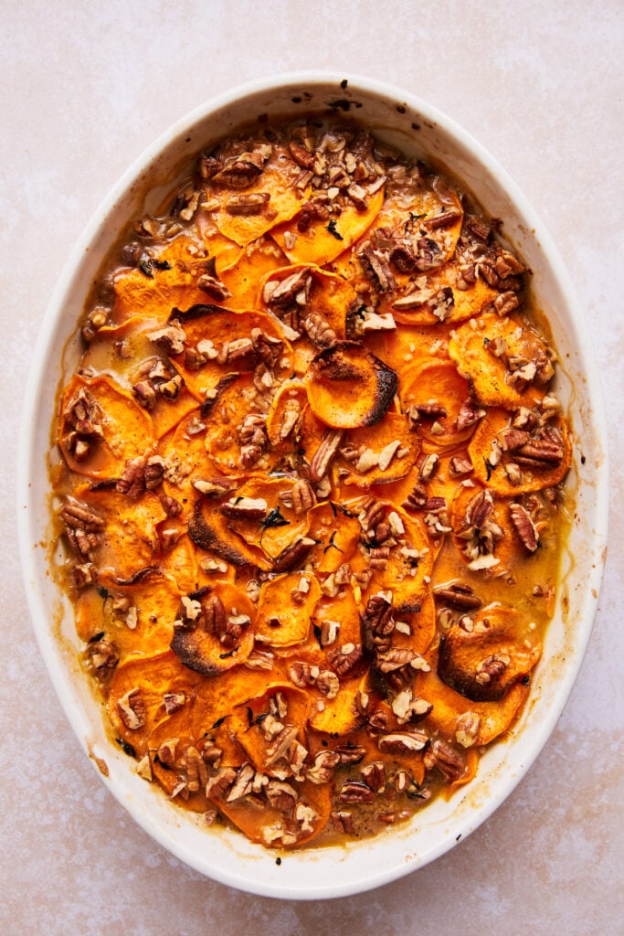baked scalloped sweet potatoes in a baking dish