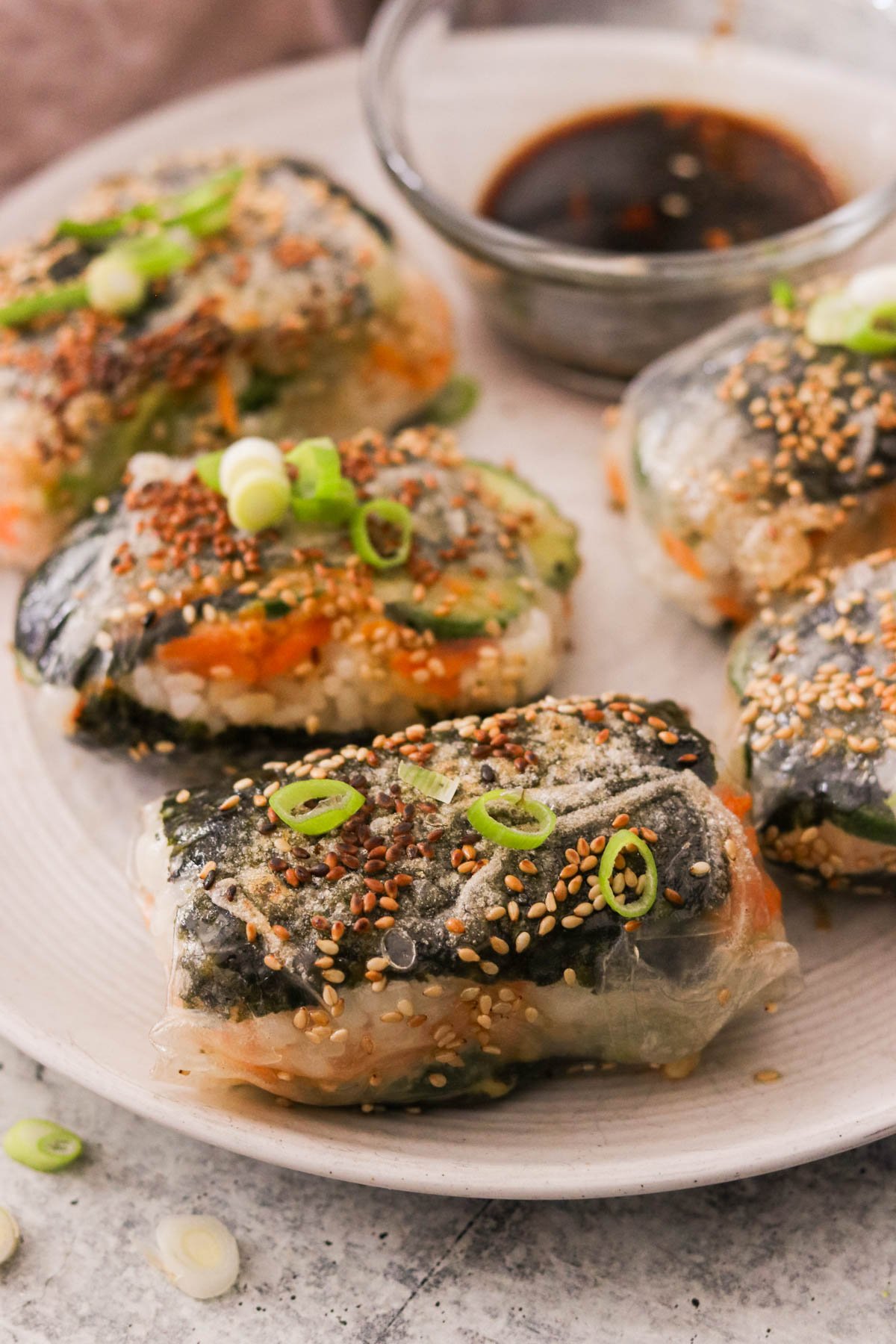 closeup of crispy sushi roll sliced in half showing tuna and veggie filling