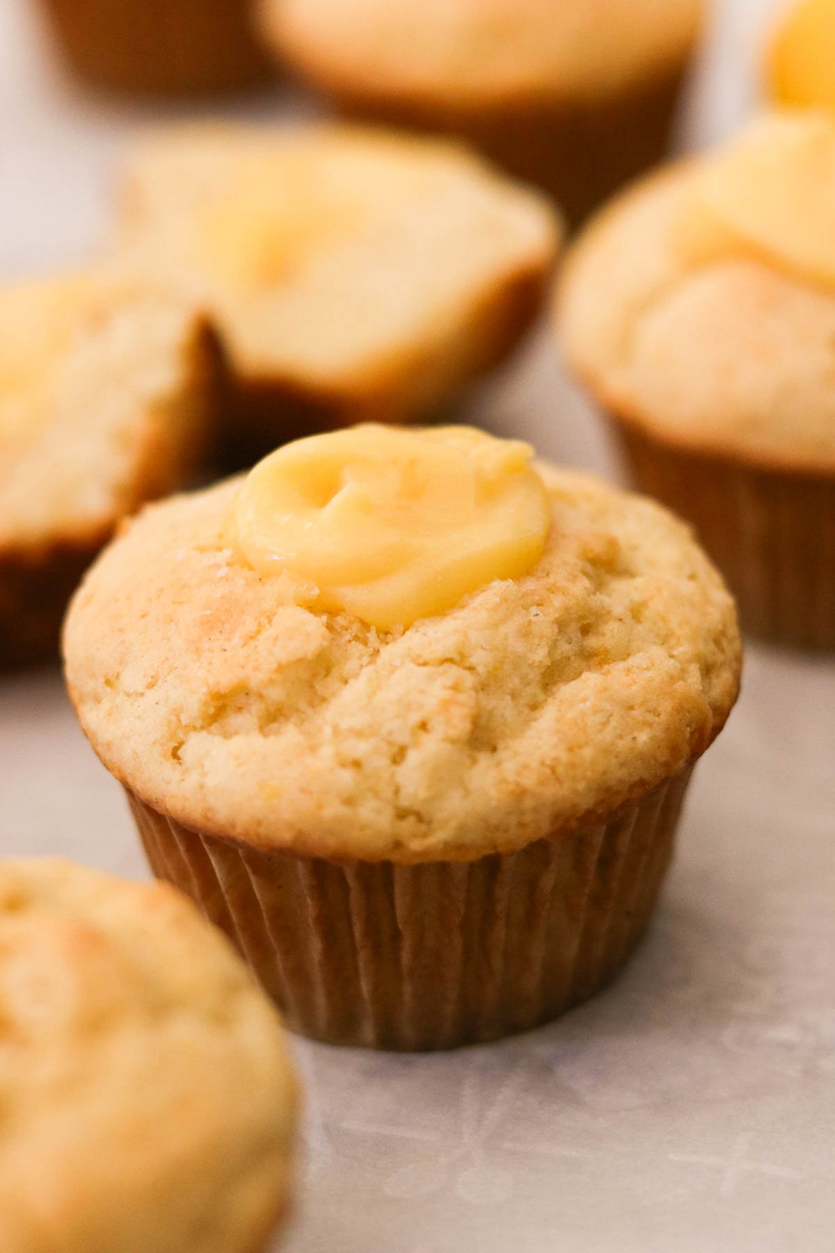 lemon curd muffins with creamy curd visible in the center
