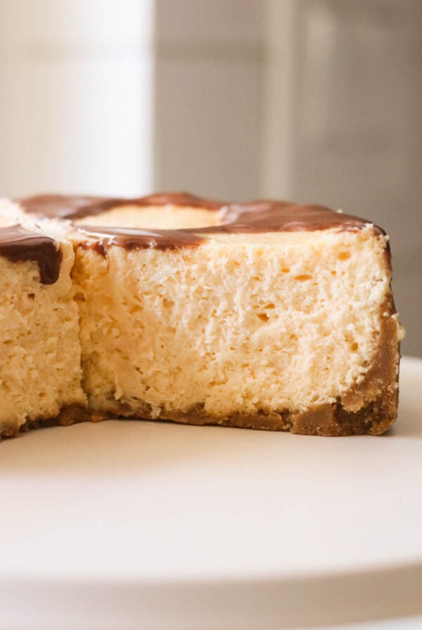 an easy cheesecake recipe sliced to show the creamy middle