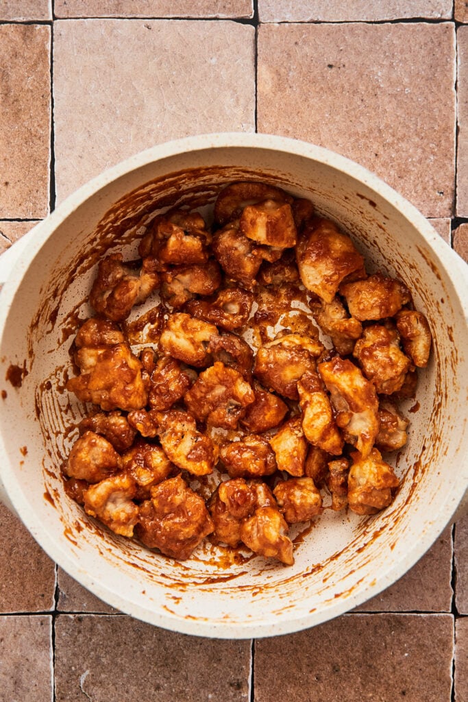 cooked sesame chicken tossed in a sauce