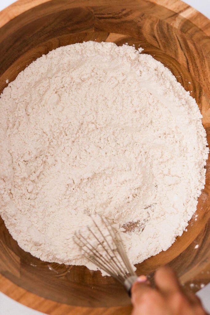 whisking flour in a mixing bowl 