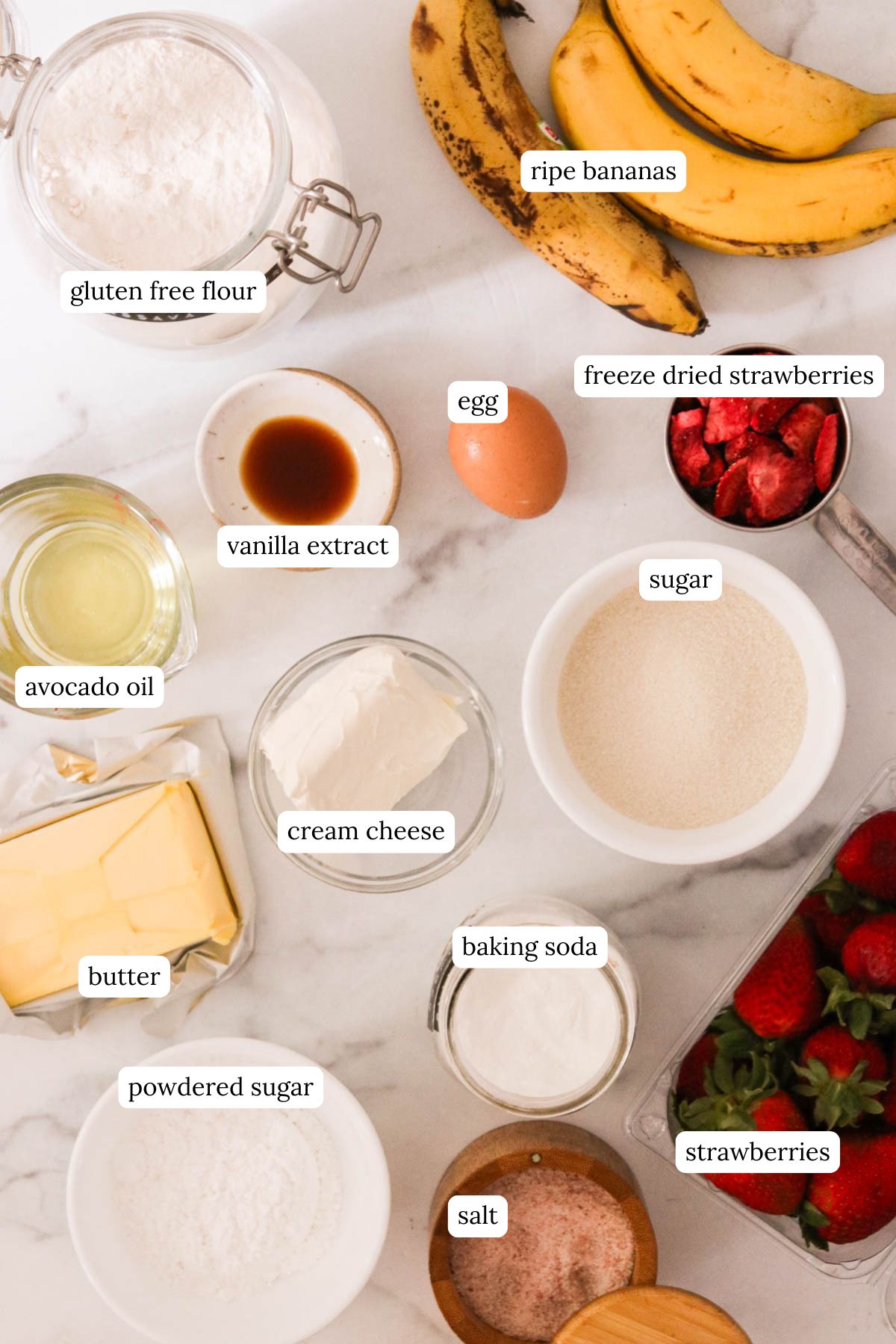 flat lay of recipe ingredients on a white marble counter, labeled. 