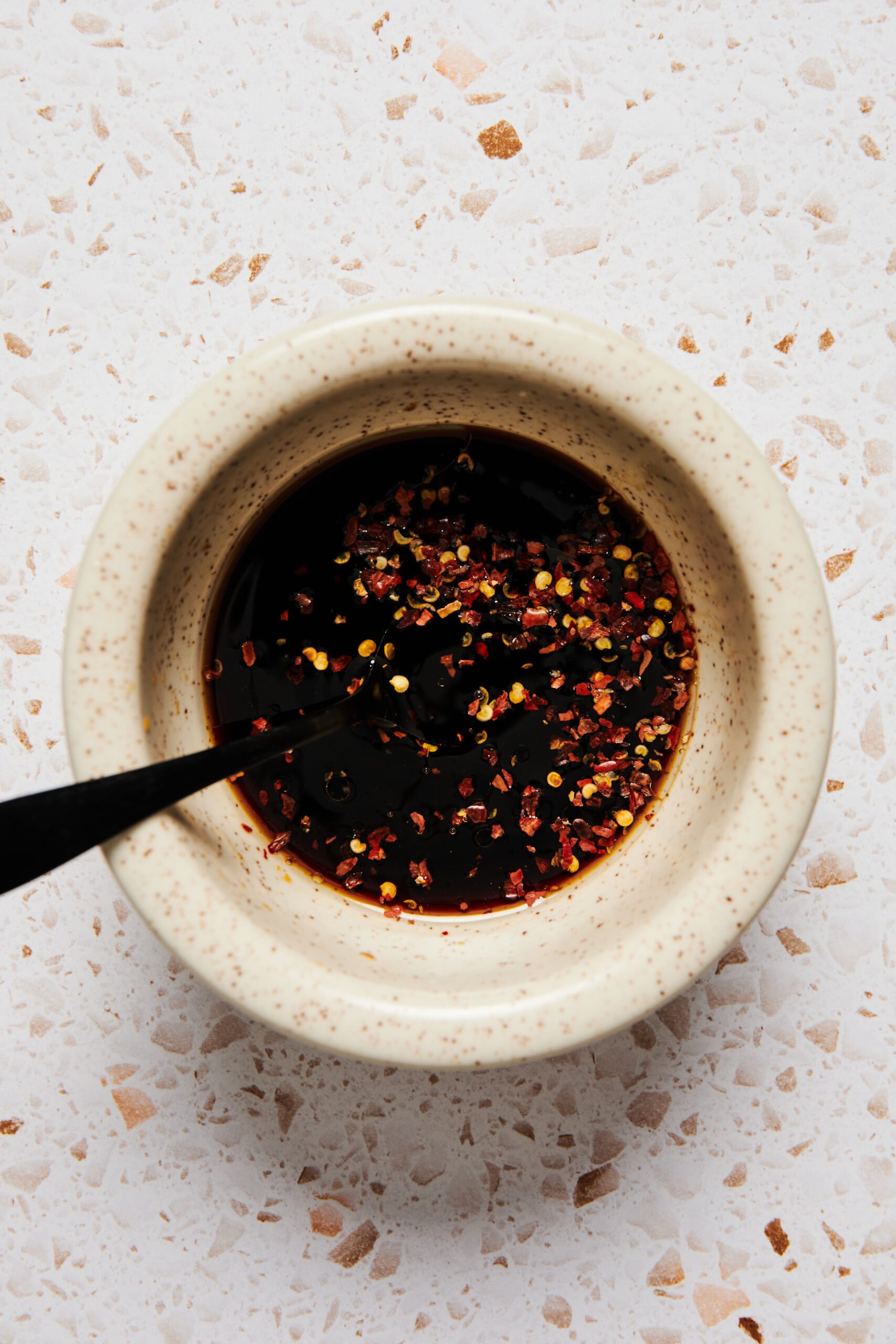 Ingredients for paleo stir-fry sauce mixed together in a small bowl.