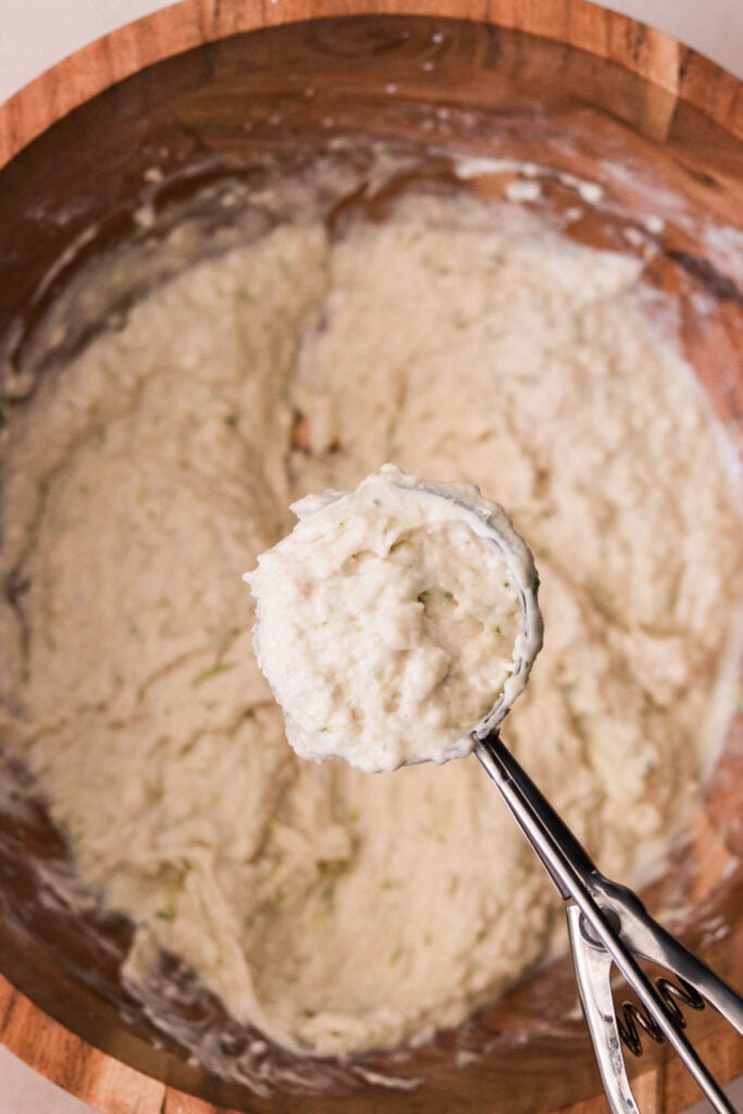 Ricotta waffle batter resting in bowl while waffle iron preheats