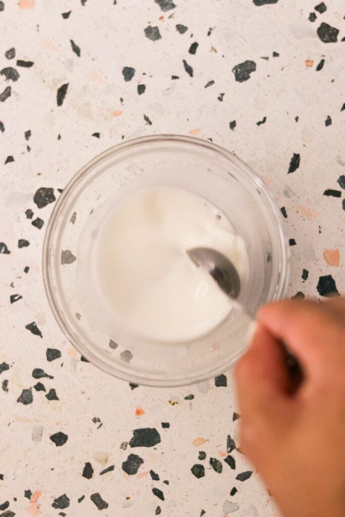 making a cornstarch slurry in a small bowl 