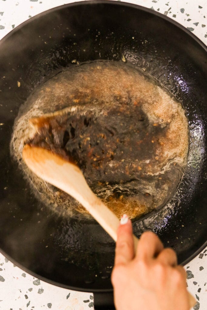 adding tamari, water, and brown sugar to the skillet with the garlic. 