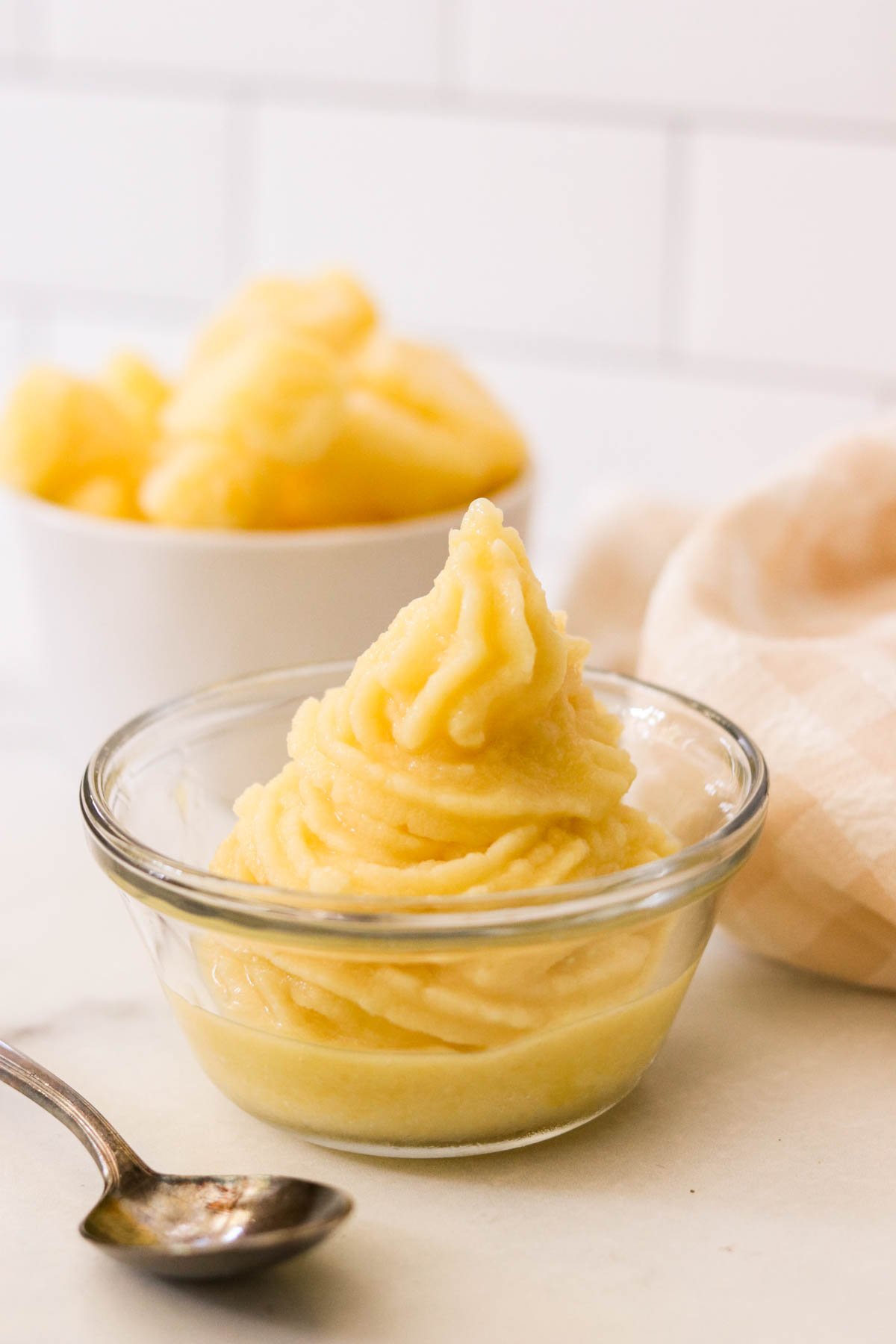Close-up of pineapple soft serve in a swirl, served as a Disney-inspired frozen treat