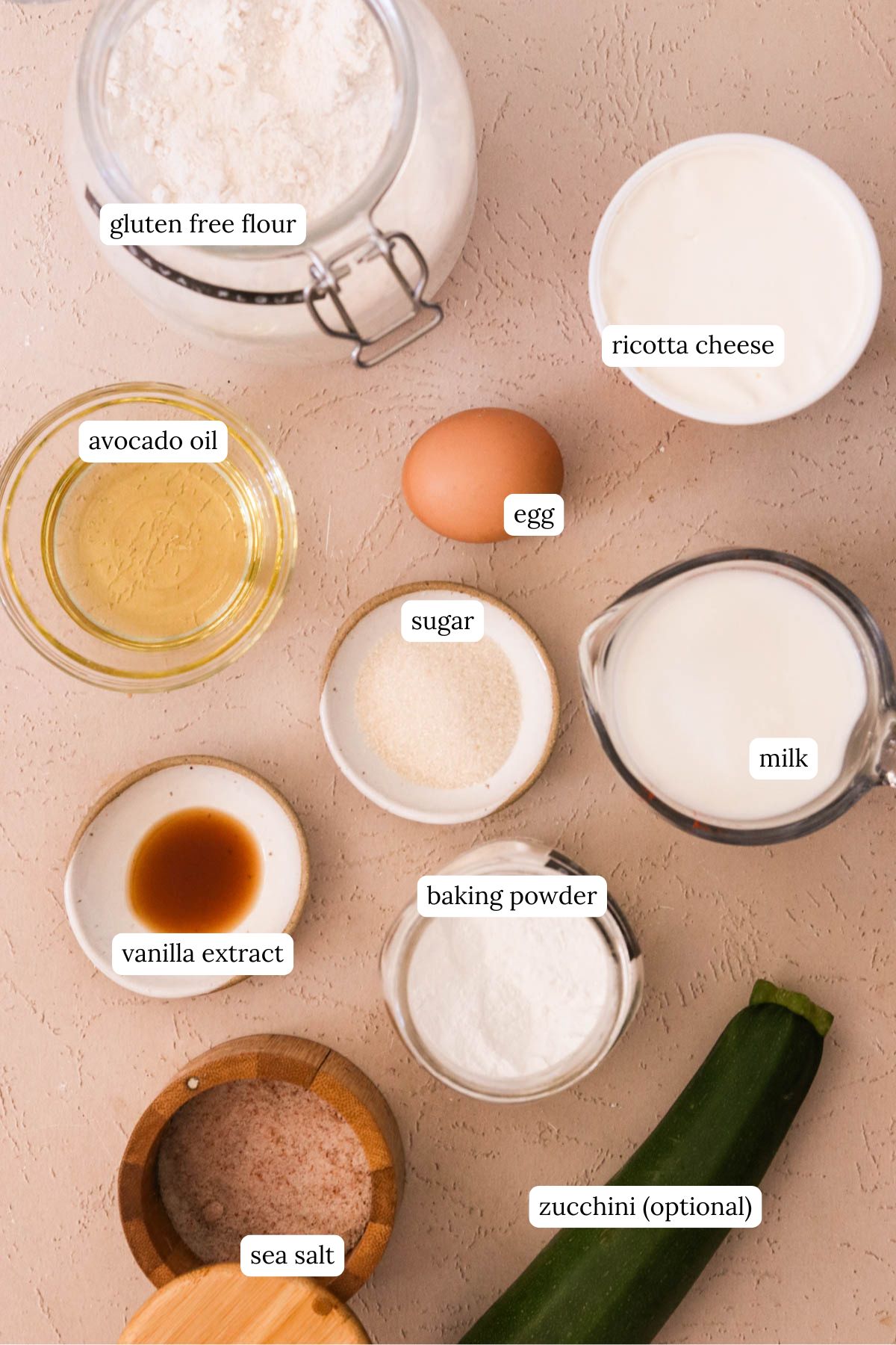 Ingredients for gluten-free ricotta waffles laid out on a white surface