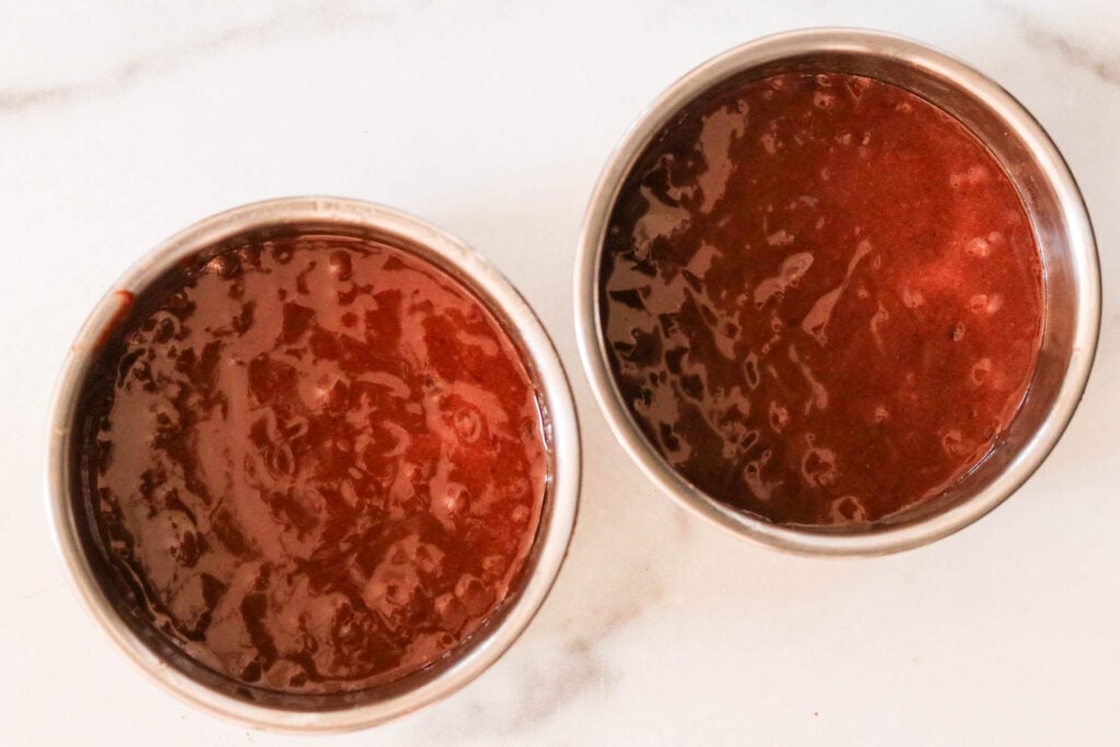 Cake batter divided into two 6 inch round cake pans