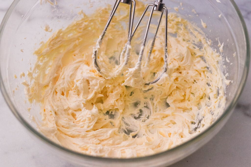 Whipped butter cream frosting in a bowl