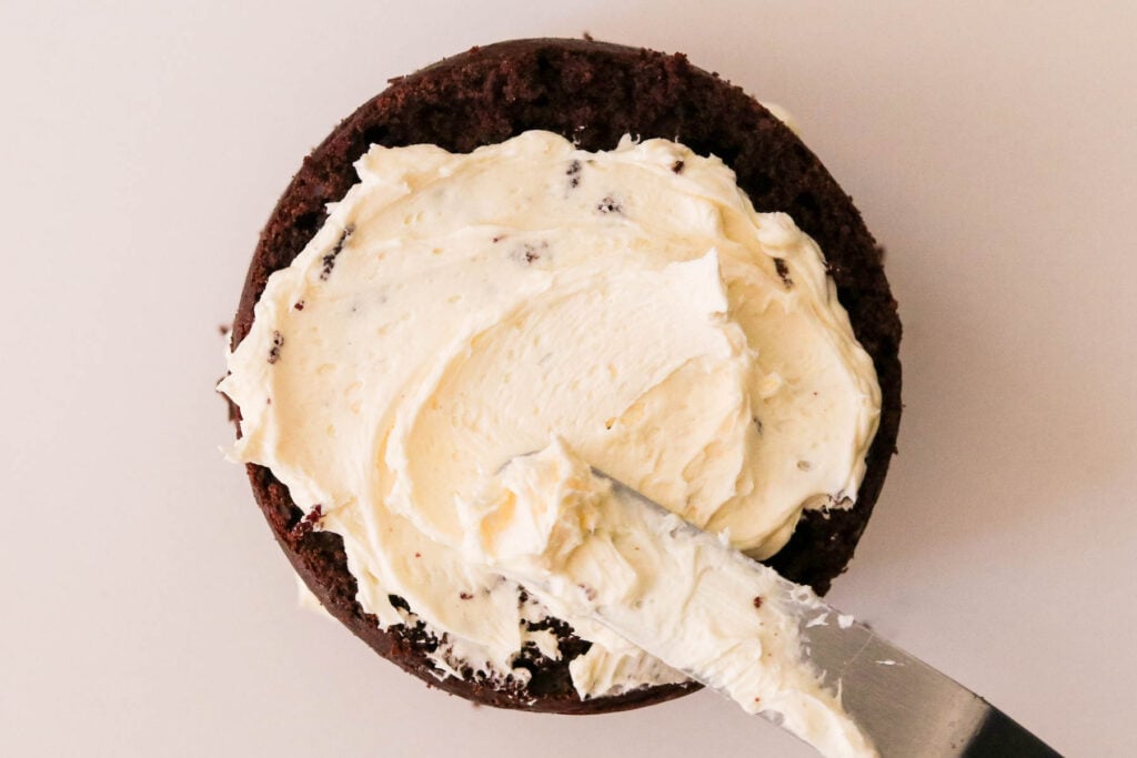 Frosting chocolate cake with buttercream frosting