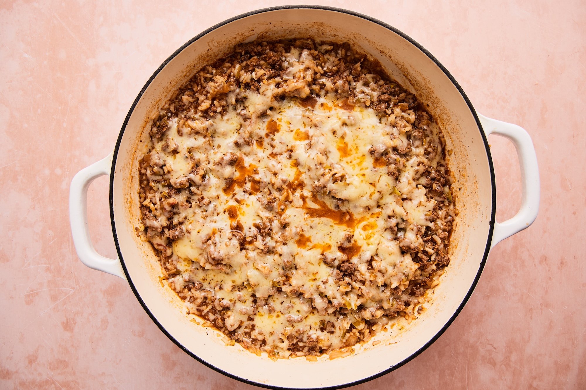 Cheese melted on top of the ground beef and rice skillet.