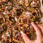 christmas crack with pretzels covered in chocolate, sprinkles, and sea salt