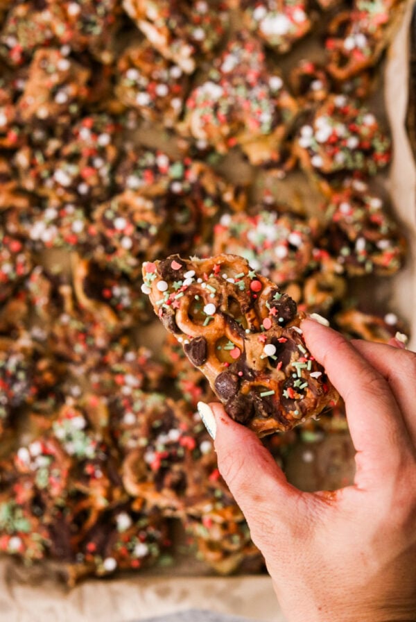 christmas crack with pretzels covered in chocolate, sprinkles, and sea salt